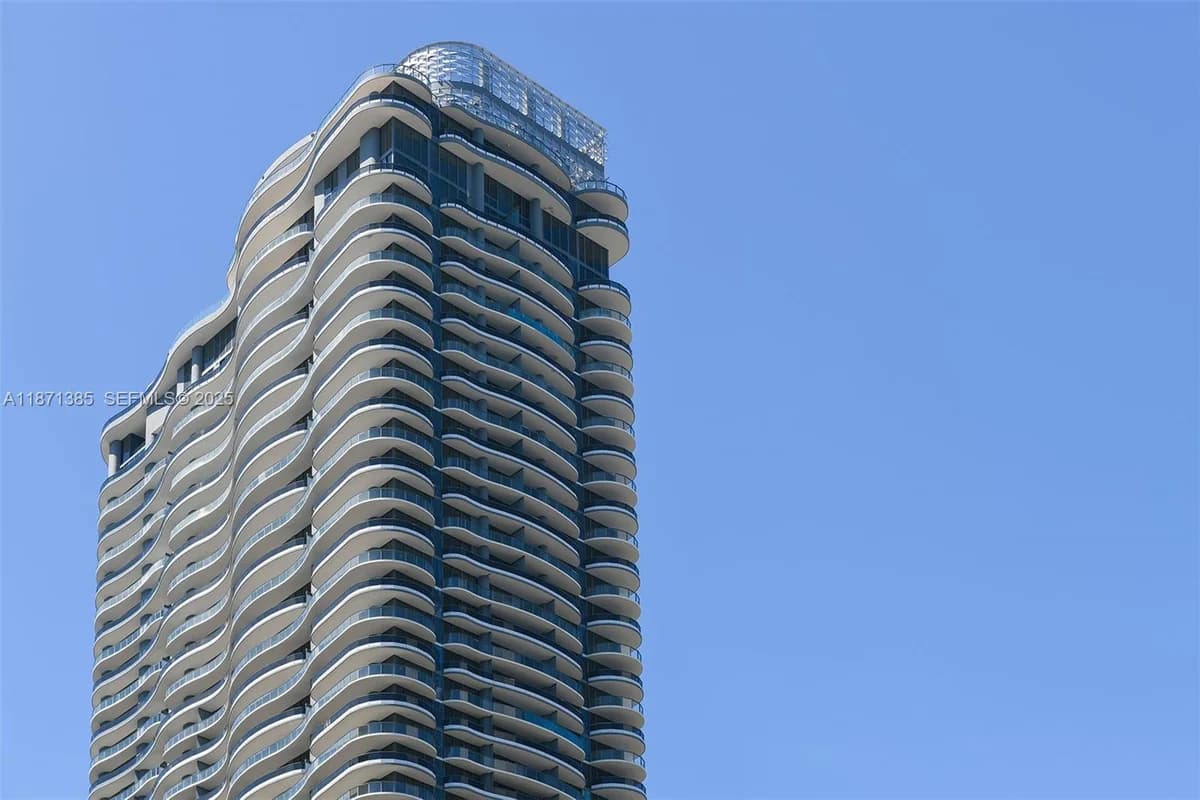 Brickell Flatiron tower with its curved glass balconies