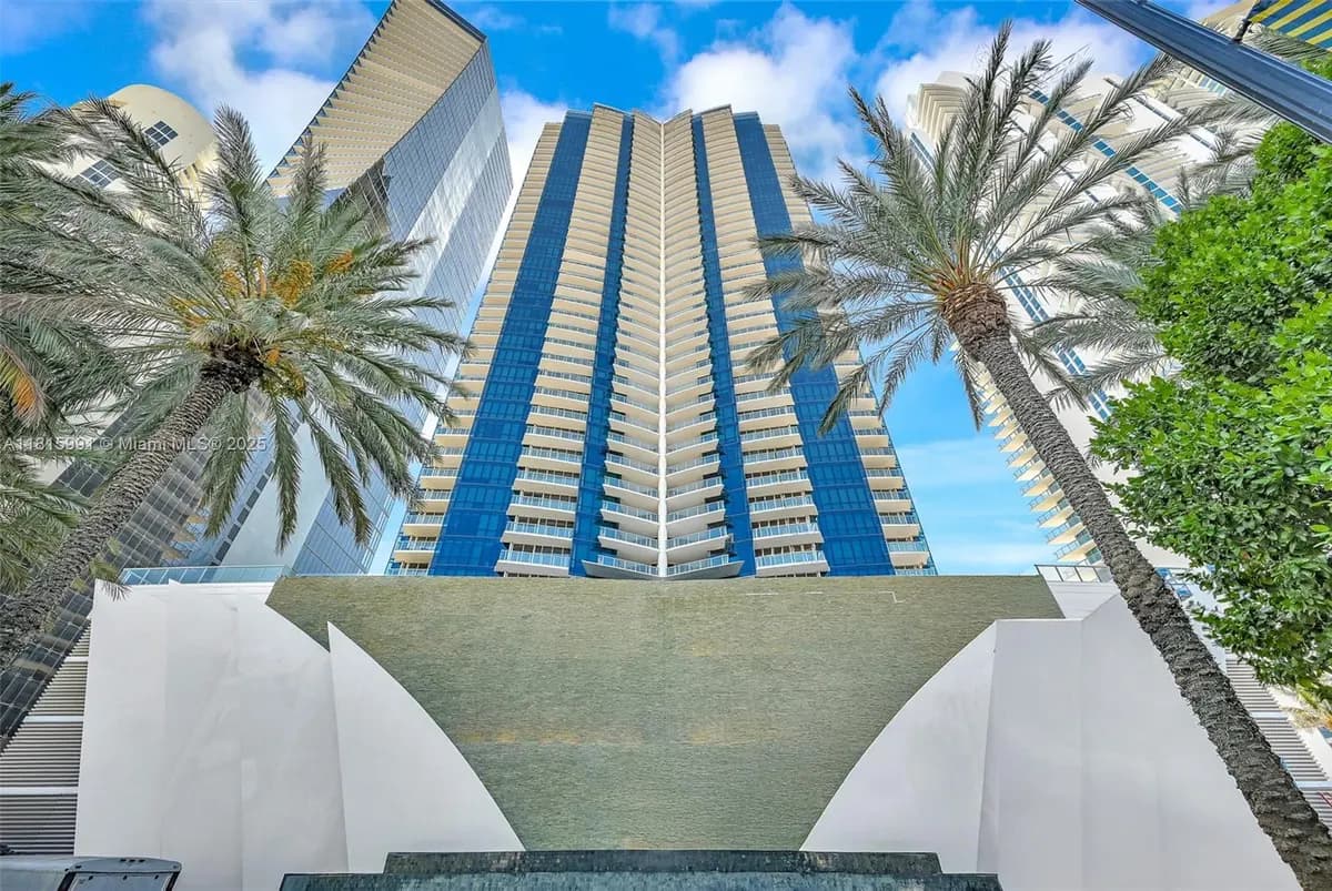 Jade Ocean glass tower and landscaped arrival in Sunny Isles Beach
