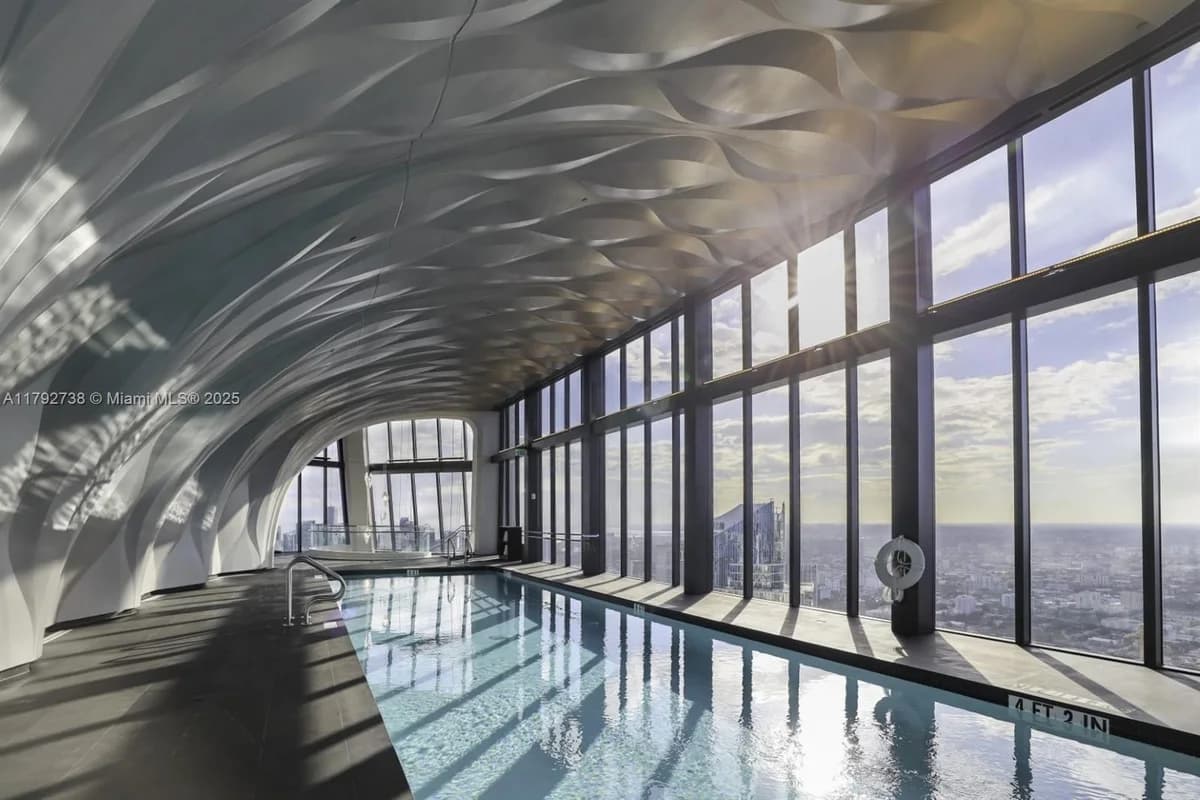 One Thousand Museum aquatic center with sculptural architecture and bay-facing windows