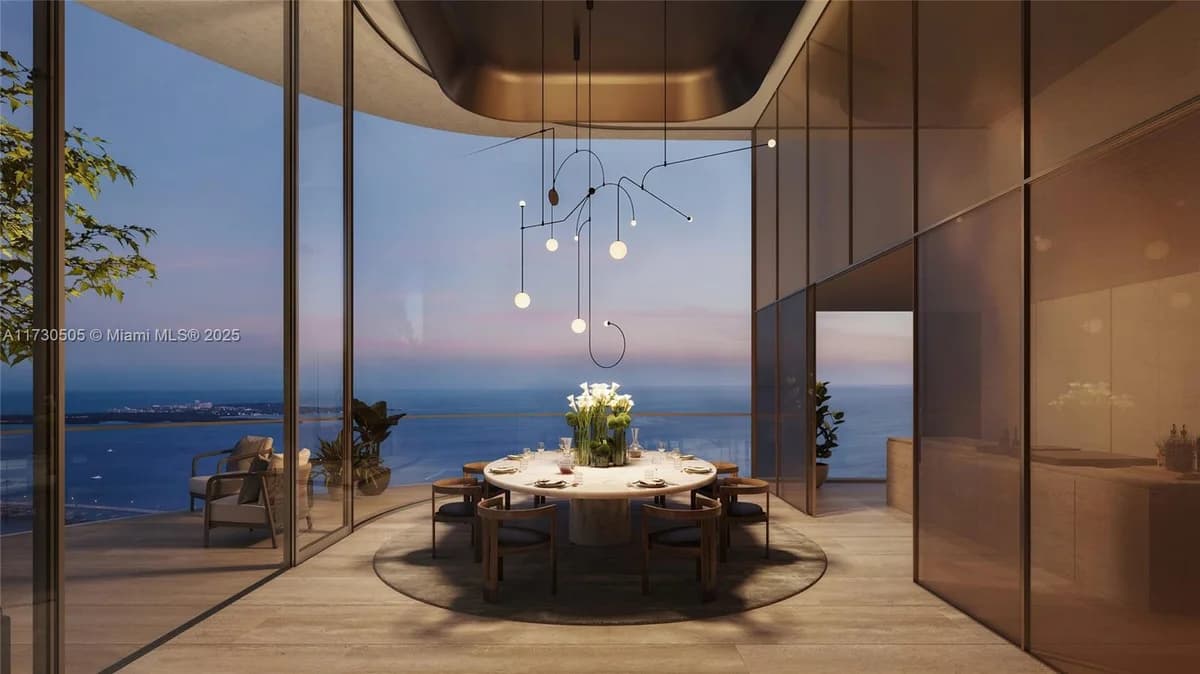 Dining room and bay view rendering at The Residences at 1428 Brickell