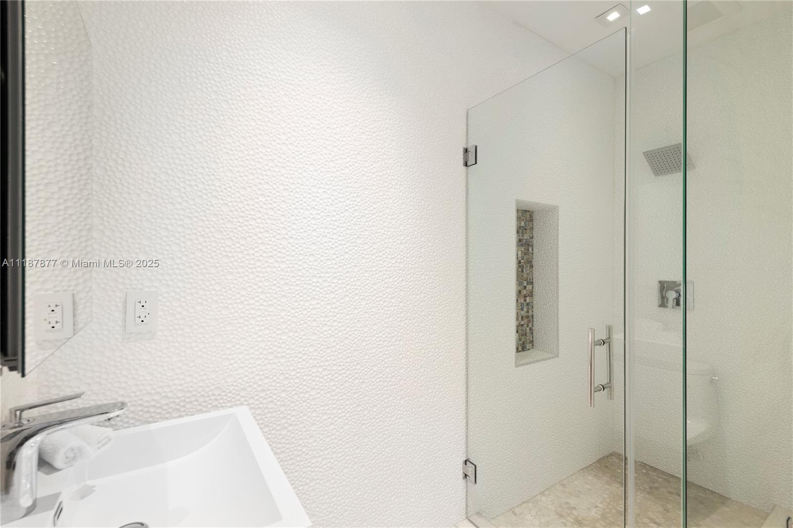 Clear glass shower with sleek chrome
