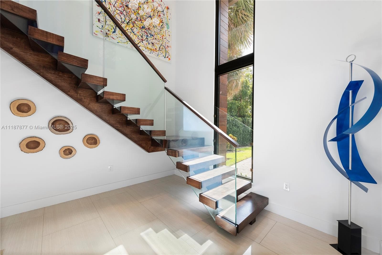 Sculptural staircase with glass rail