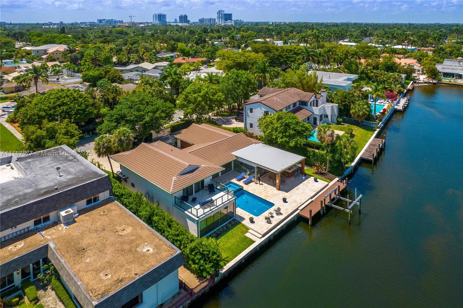 Canal curve with boats and backyards