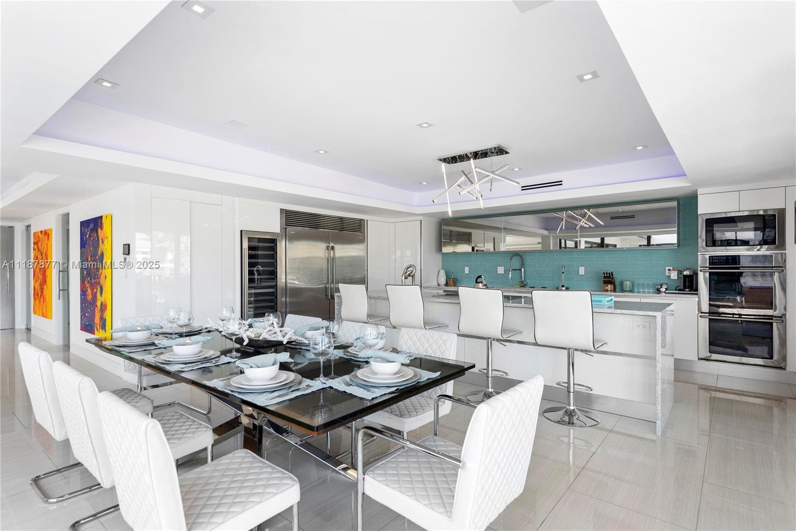 Sleek dining with chef kitchen glow
