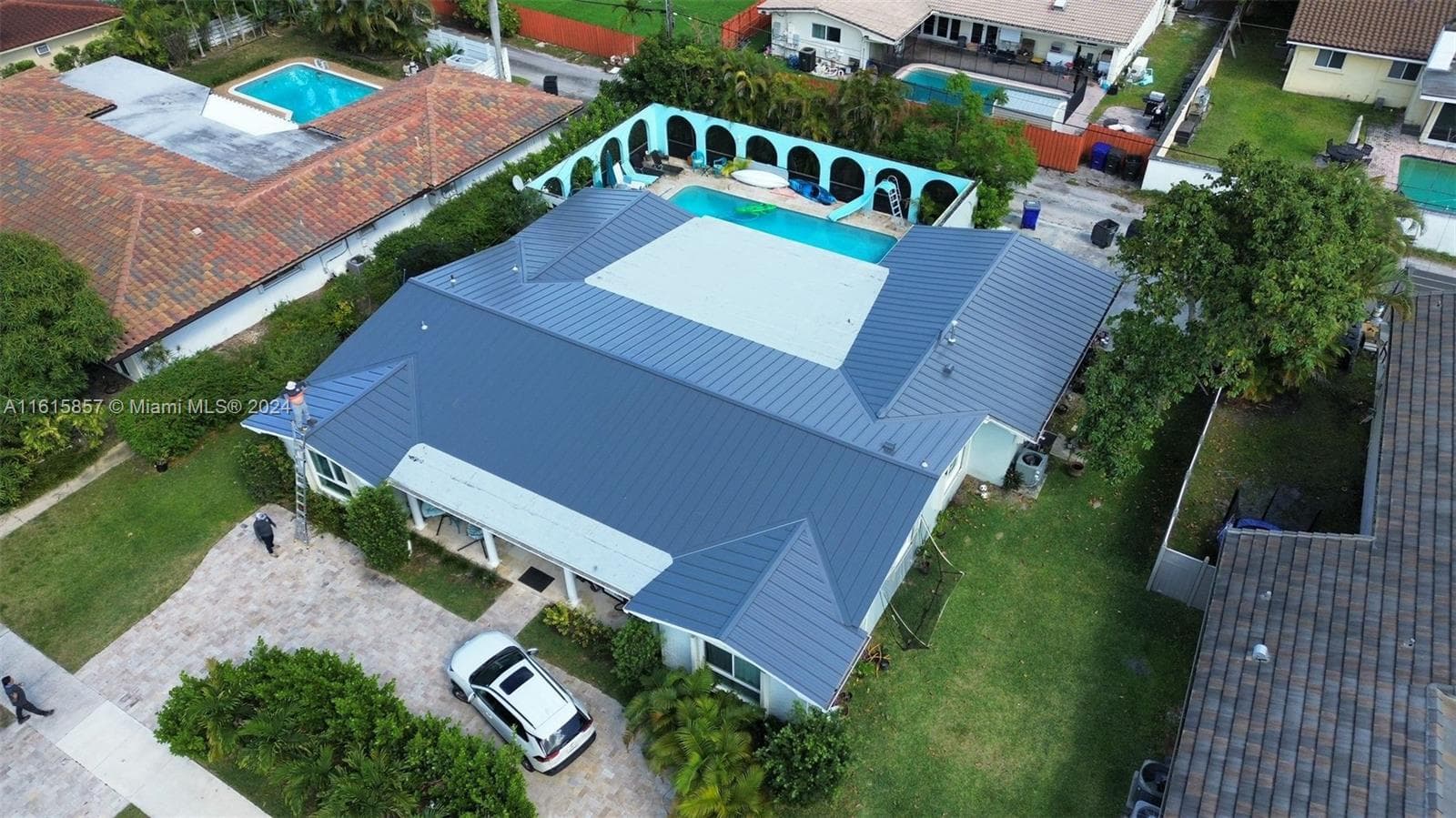 Plenty of Parking, Circular Driveway and 2 Car Garage in Alley.