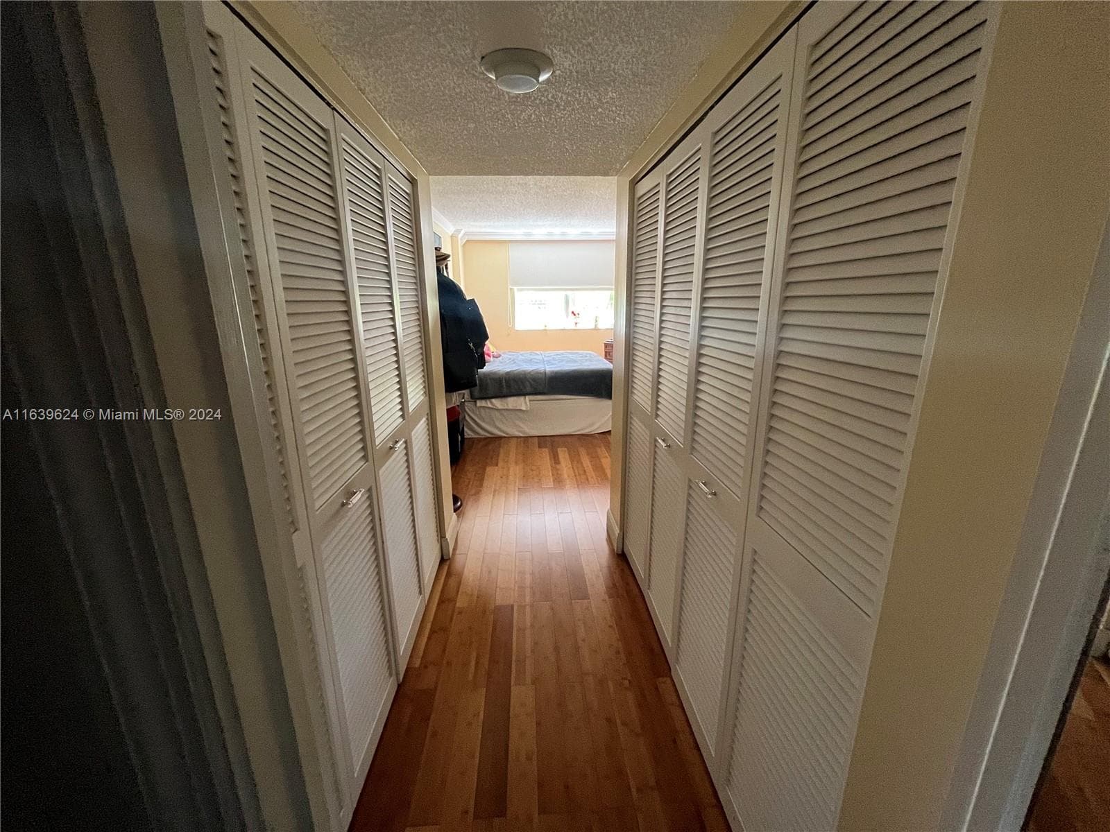 Walking closet hallway.Very spatious walking closet. The closet separate the bathroom from the bedroom.(photo from the bathroom)