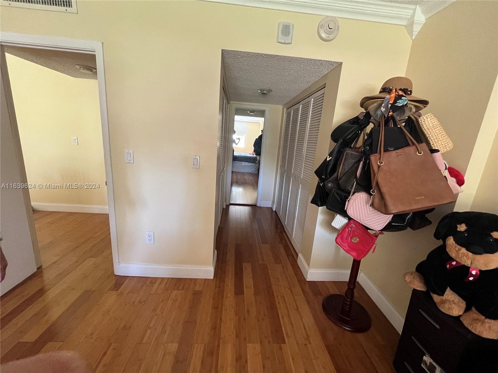 Walking closet hallway.Very spatious walking closet. The closet separate the bathroom from the bedroom.(photo from the bed)