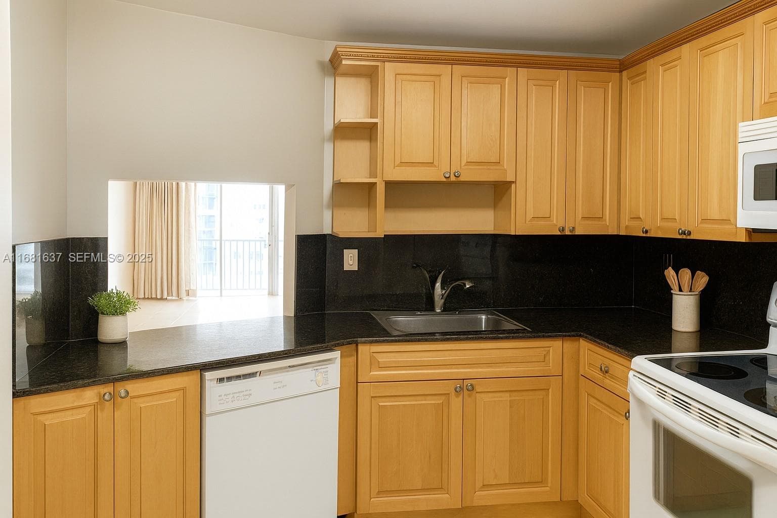 beautiful kitchen made out of solid wood and granite countertop