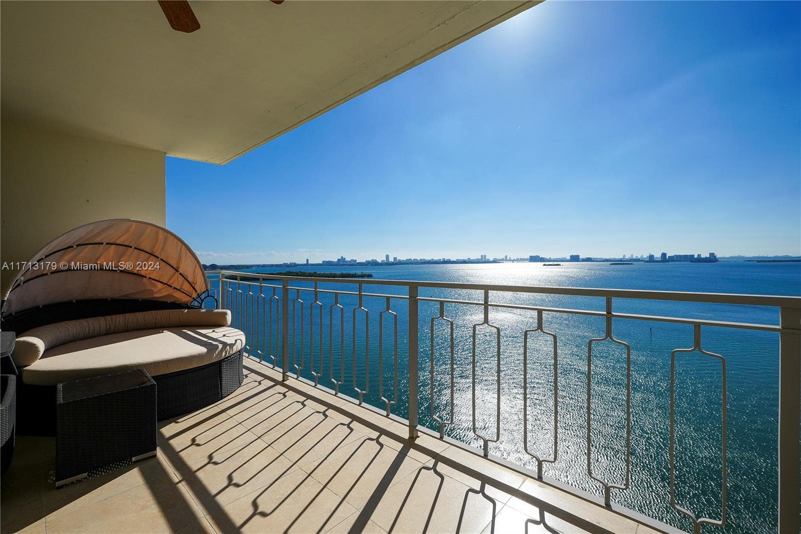 A Spacious Balcony with enough room for table and chairs and a circular chaise lounge to relax in with a good book