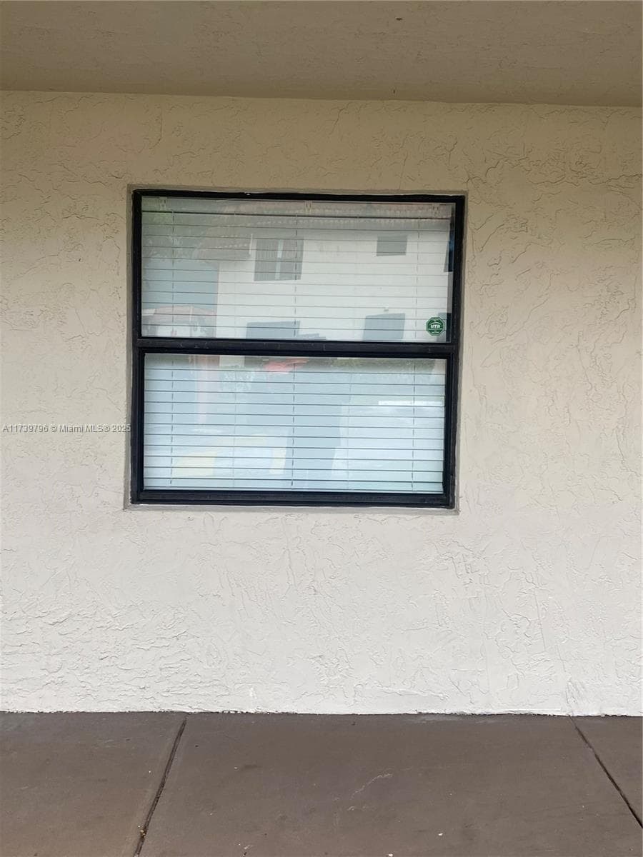 front bedroom window view from parking area