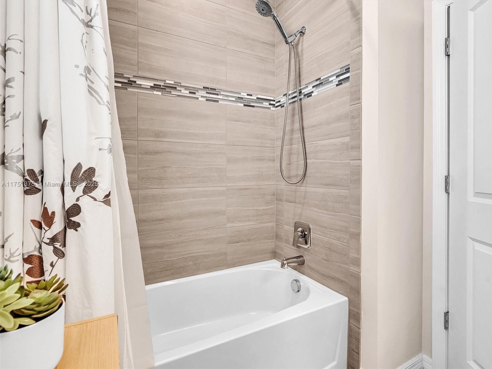Outstanding tile work with tiles all the way to the ceiling