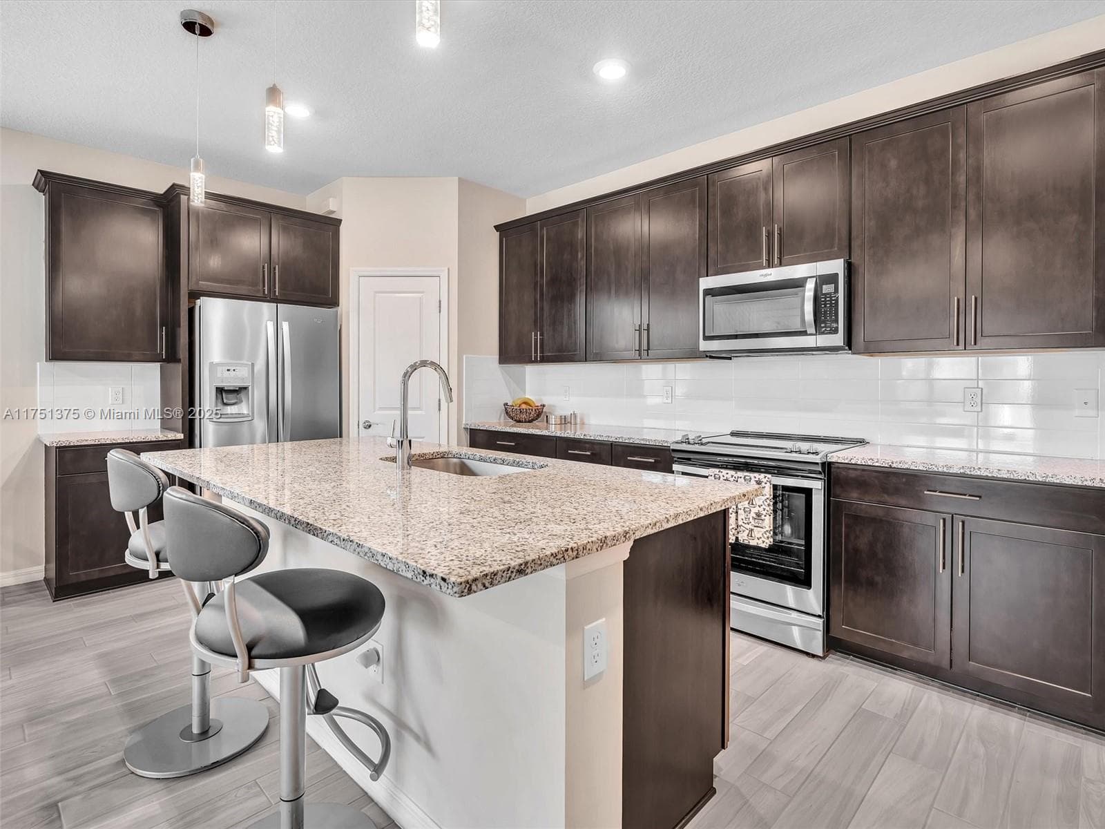 Chef's kitchen open to living areas