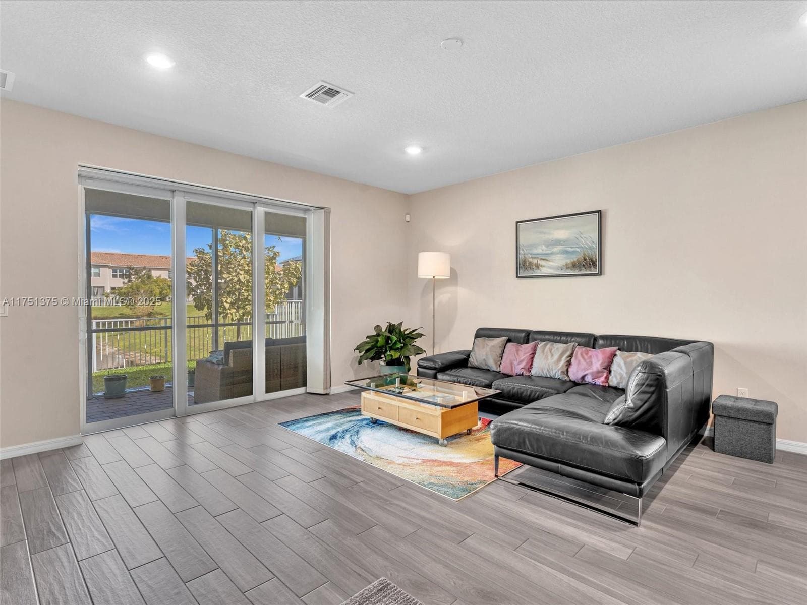 Living room with pocket sliding doors out to screened patio
