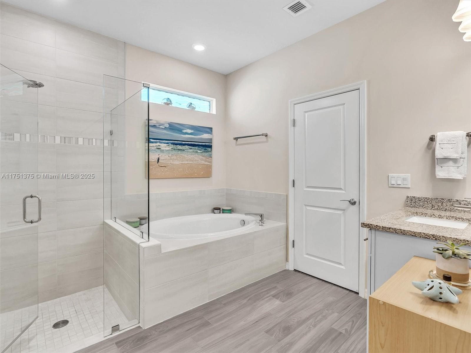 Frameless glass shower door and a cozy spa oasis!