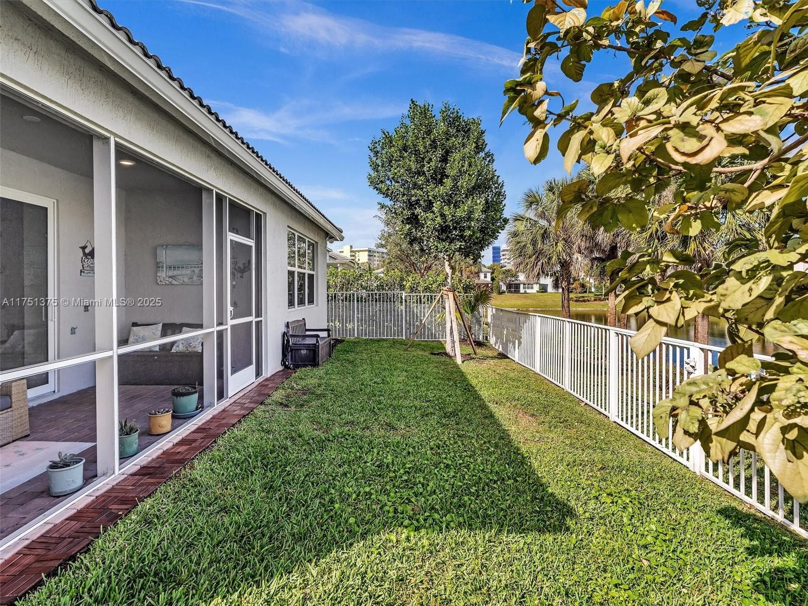 Fenced in yard - perfect for your pets or kids to play! HOA maintains lawn, tree trimming, and mulching
