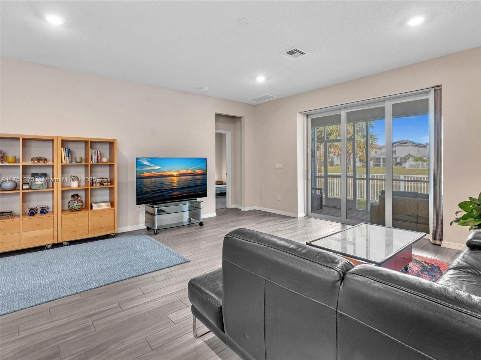 Living room with entry into primary bedroom