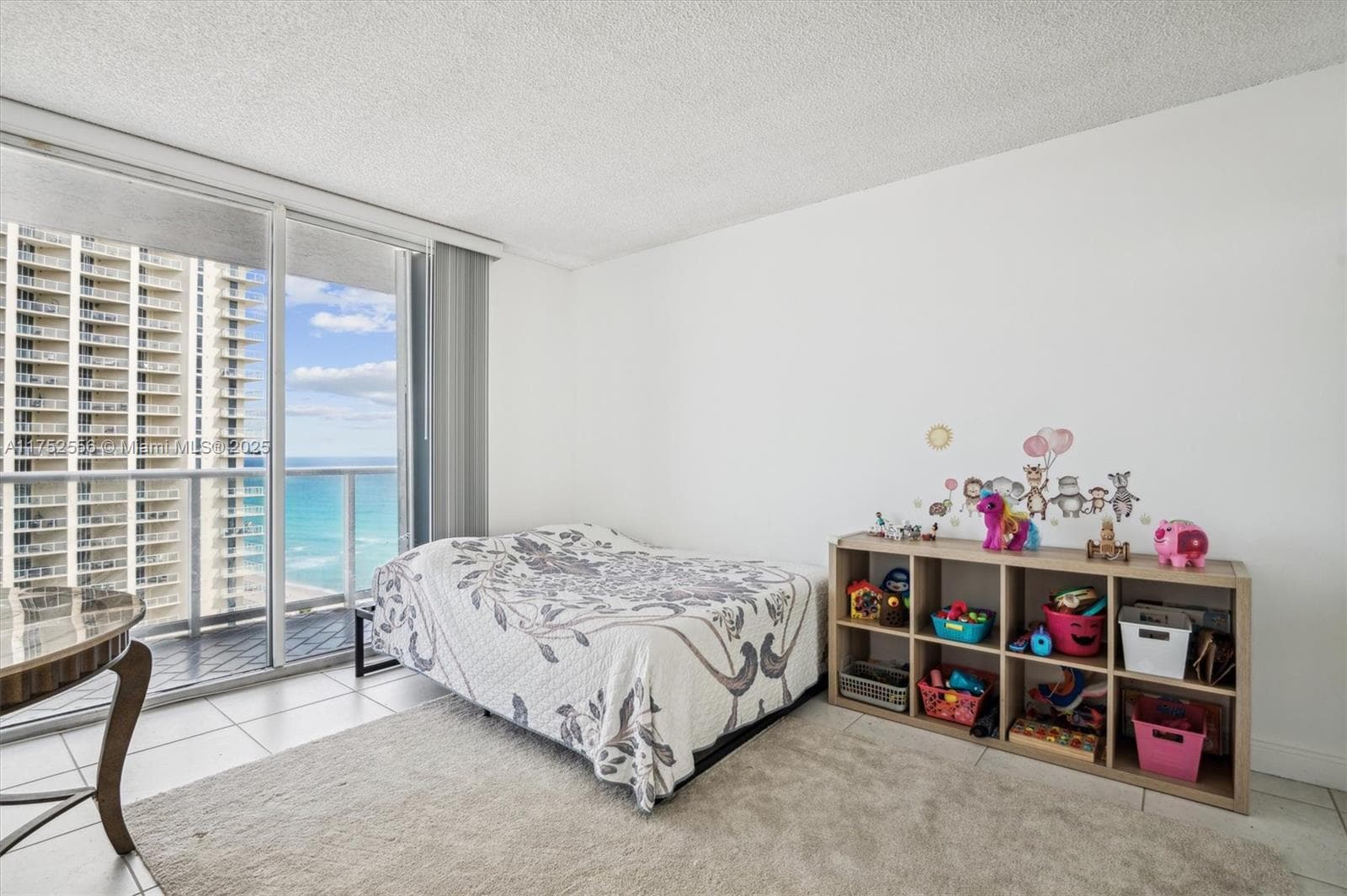 2nd Bedroom with Balcony & Ocean Views w/ Built Out Closet and Entrance to Bathroom.