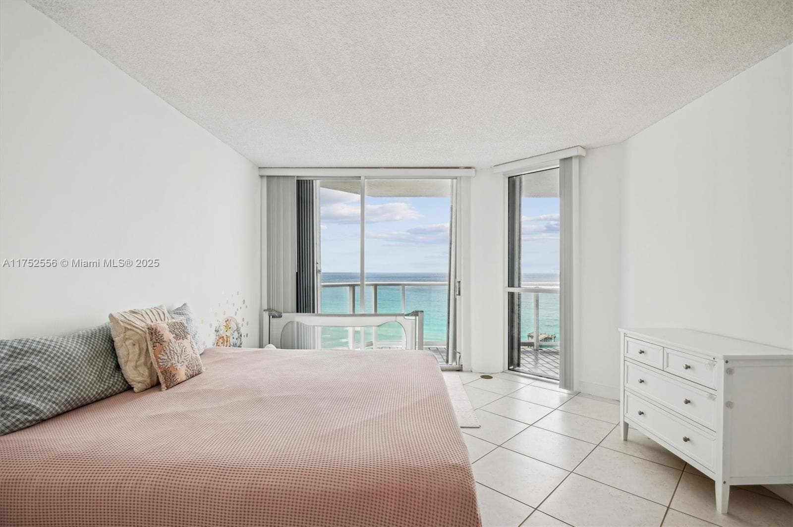 Spacious Primary Bedroom w/ Walk in Closets and Entrance to Balcomy for Ocean & City Views.