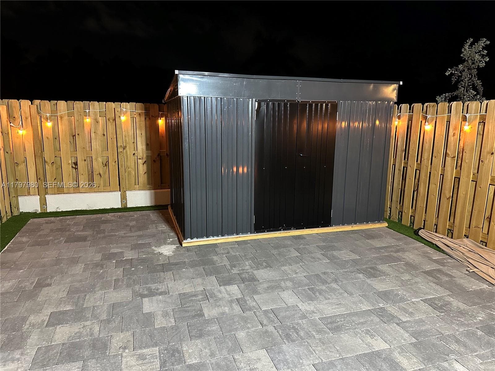 Patio with large shed
