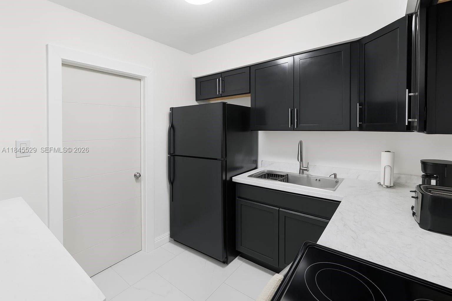 Well designed kitchen space with newer counter top