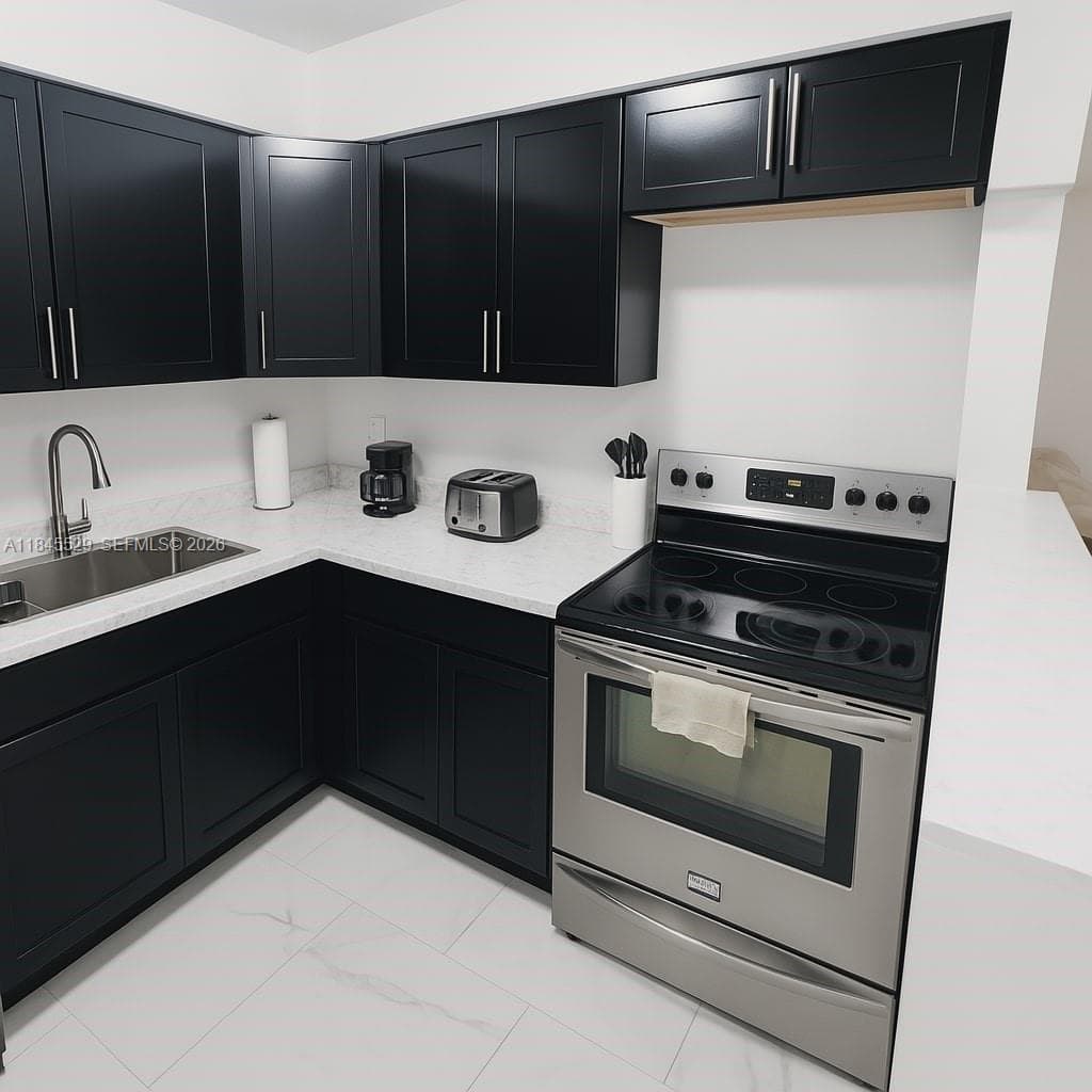 Stainless steel range/oven with newer black shaker cabinets