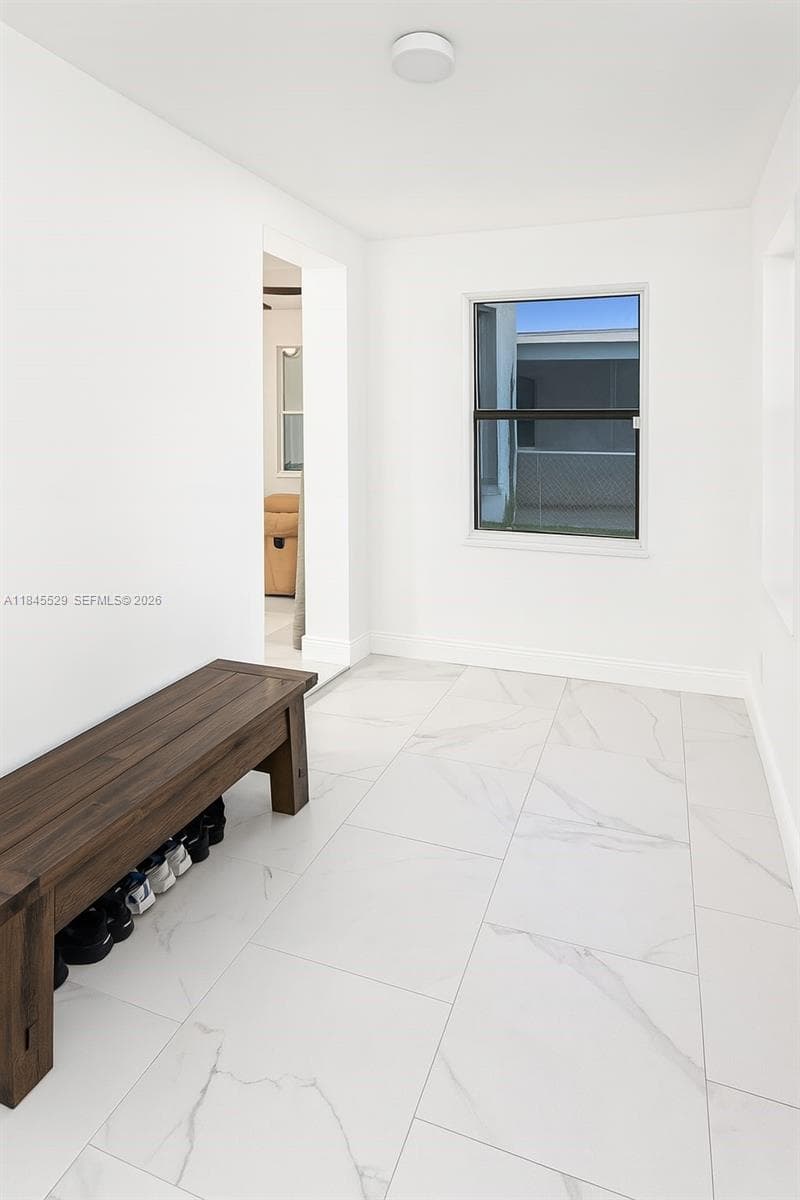 Florida room with 2 windows offers plentiful natural light