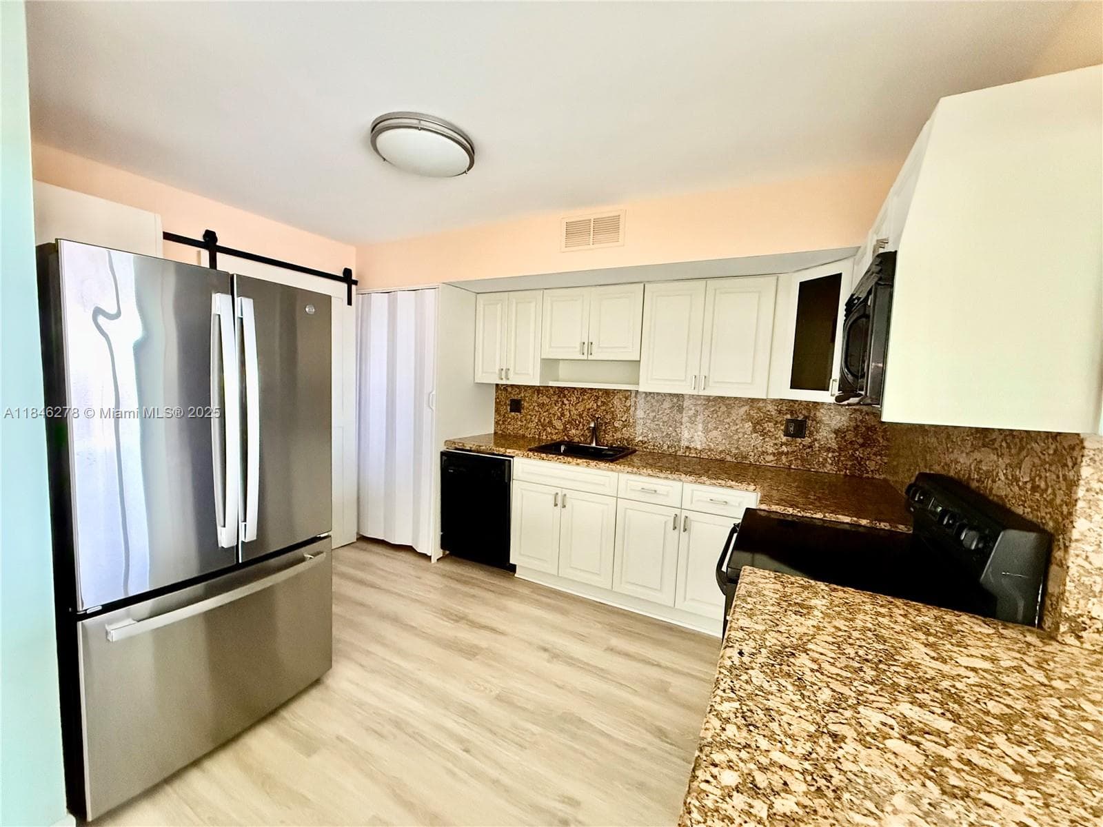 Updated kitchen with new SS refrigerator