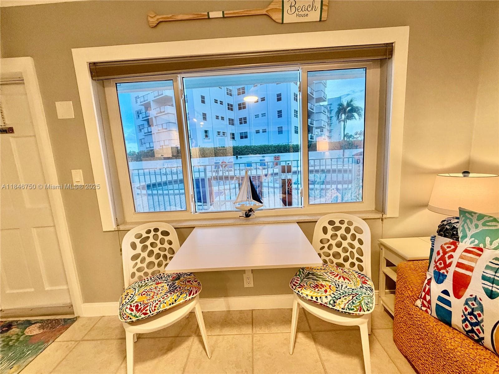 Bistro folding table overlooking the pool.