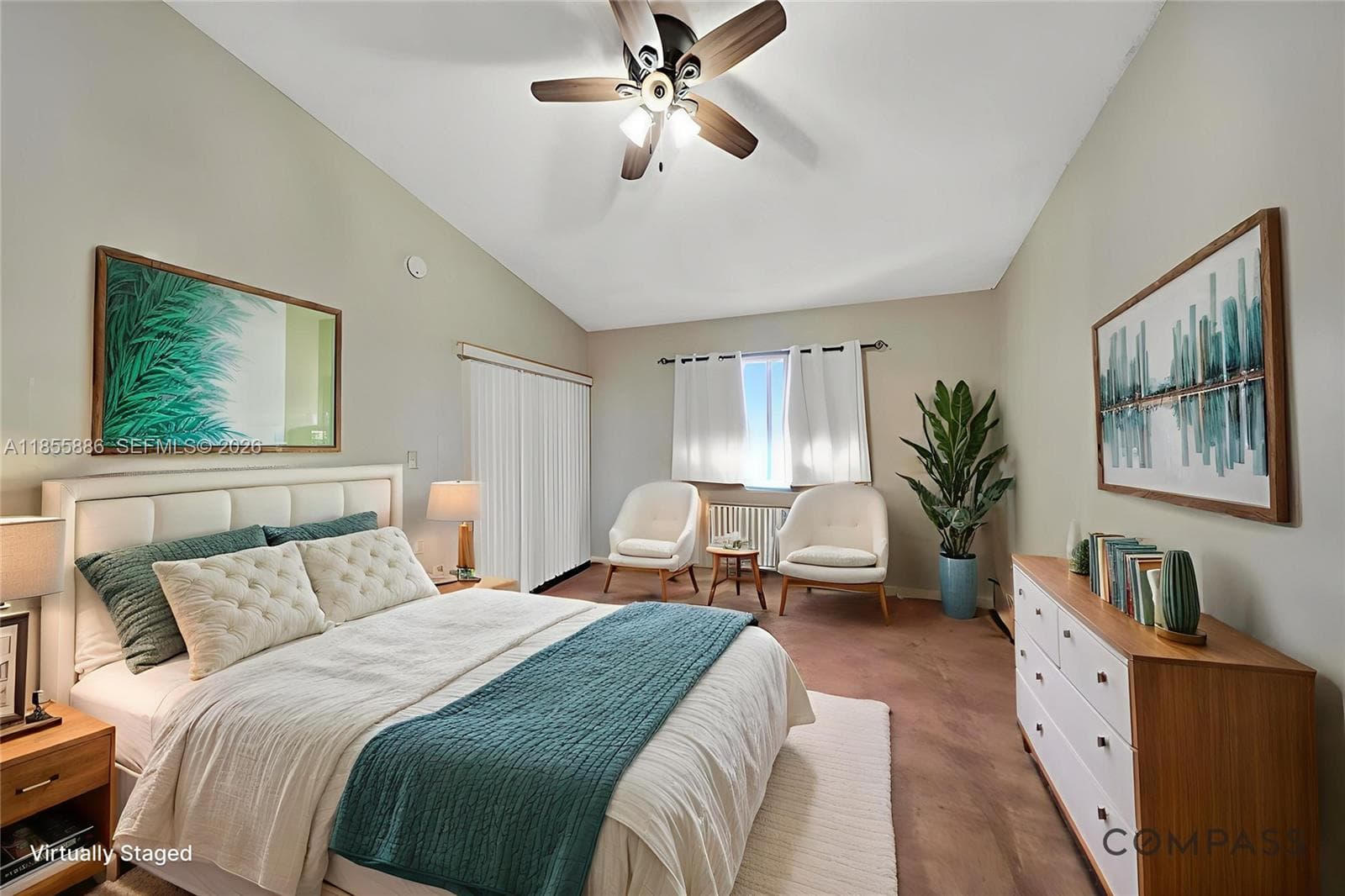 Generous living room with polished wood floors and a seamless view of the porch.