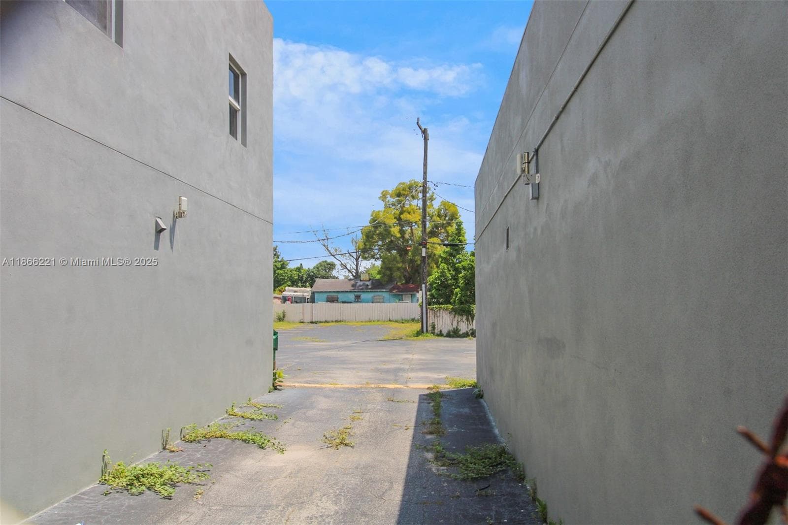 Access to the paved parking in the back is from NW 36th Street between 3270 & 3288 NW 36th Street