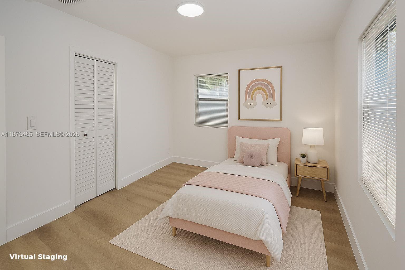 Fully renovated kitchen boasting sleek quartz countertops, stainless steel appliances.