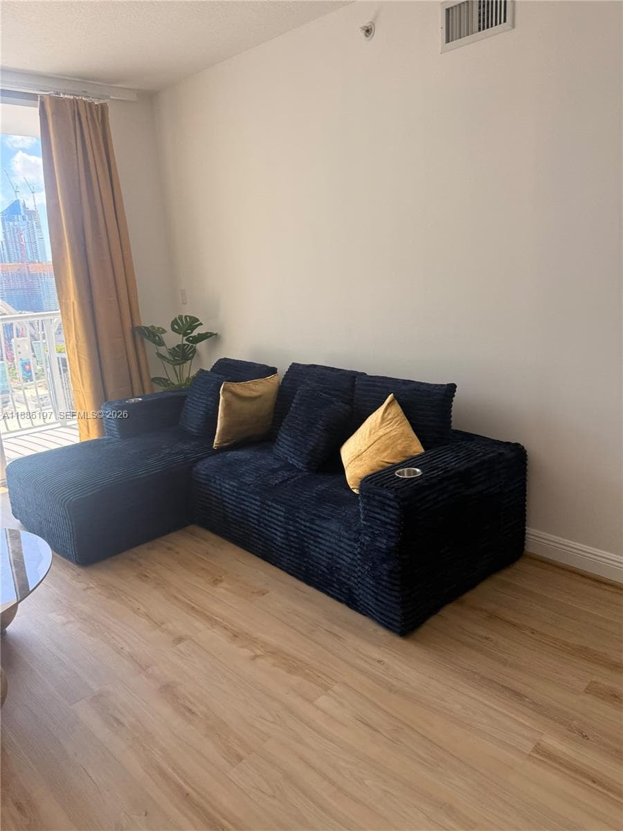 Wood-finish flooring and access to a private balcony