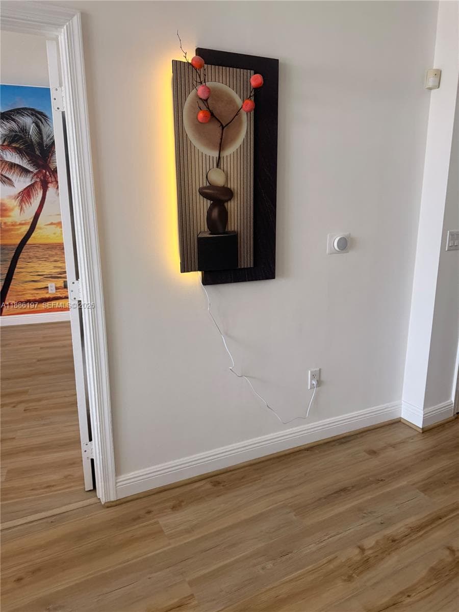 Wood-finish flooring throughout the space