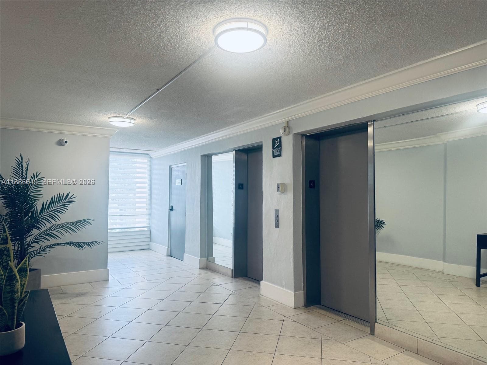 Lobby Highlighting Two Elevators