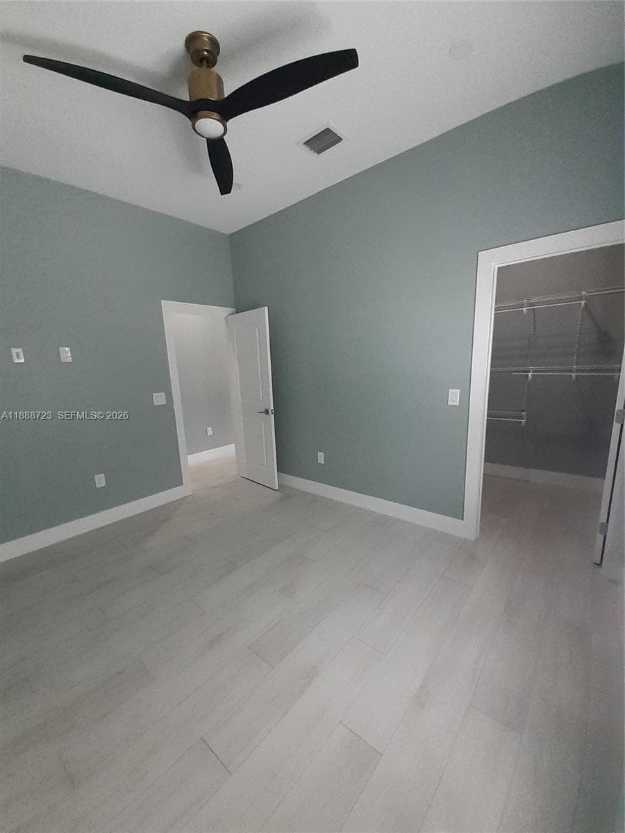Bedroom 1 w/View to Walk-In Closet