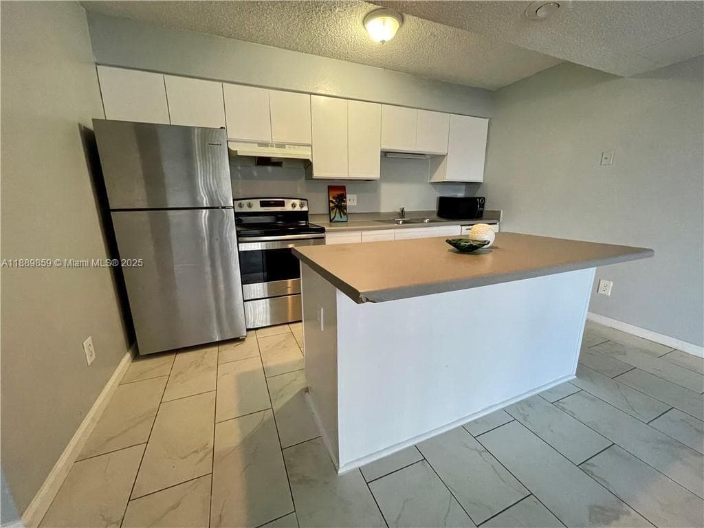 WINDWARD LAKES CONDO · #A101 in Pompano Beach - Photo 1