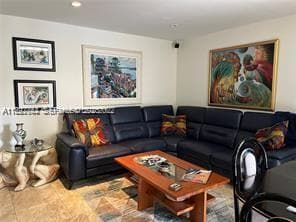 Spacious living room feels larger with recessed lighting.
