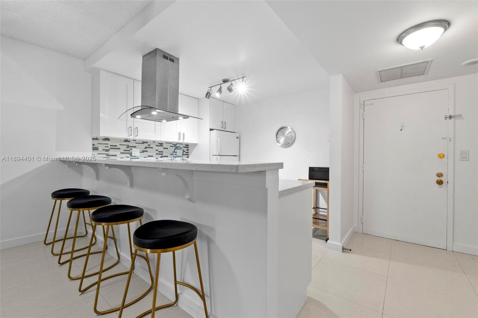 Convenient breakfast bar for informal dining with undermount LED lighting