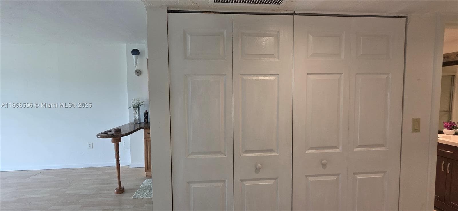 Hallway with closet double doors