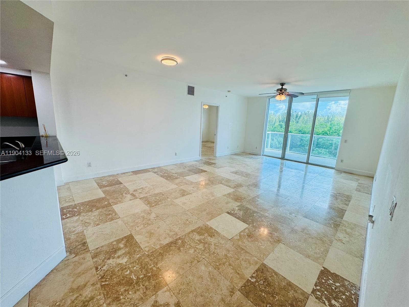 Open kitchen with stainless steel appliances and extra cabinets space