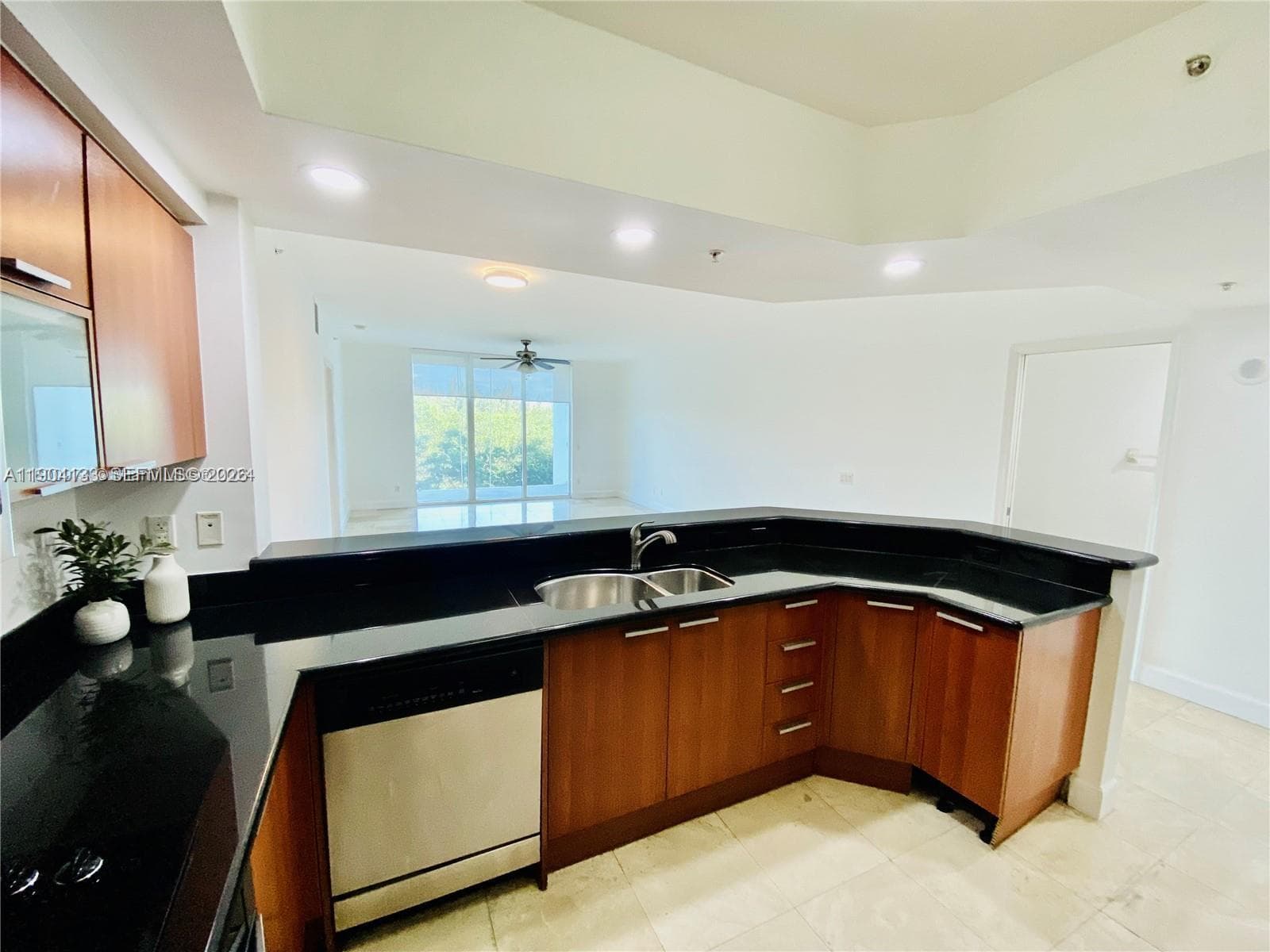 Open kitchen with stainless steel appliances and extra cabinets space
