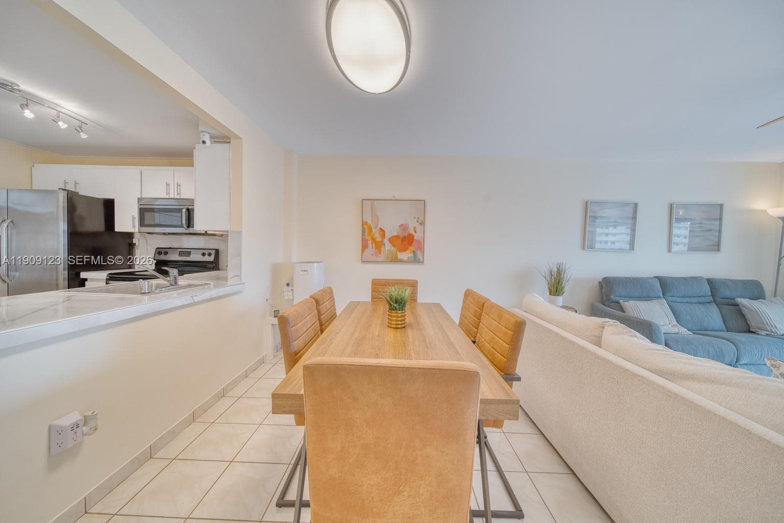Dining area adjacent to kitchen with open bar counter for casual dining.
