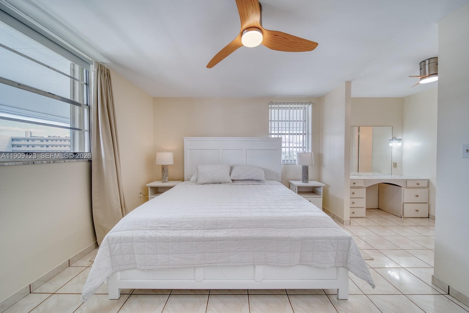 Another view of the large primary bedroom showcasing its comfort and space.