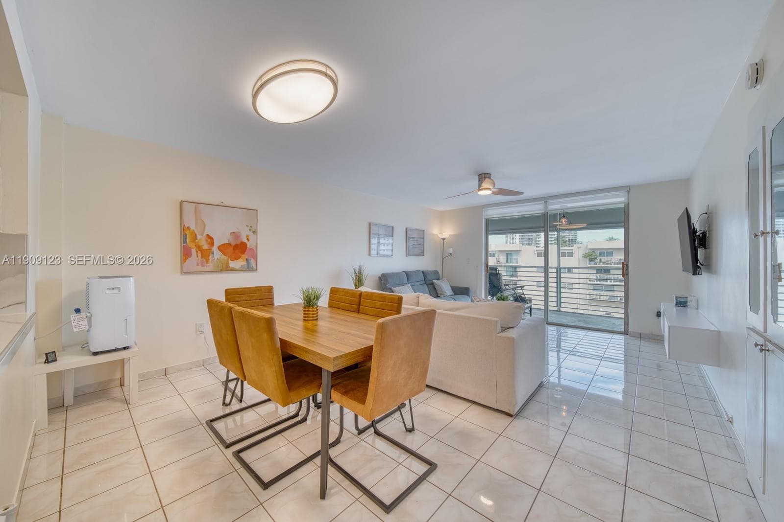 Bright open-concept living area with natural light and seamless indoor-outdoor flow.