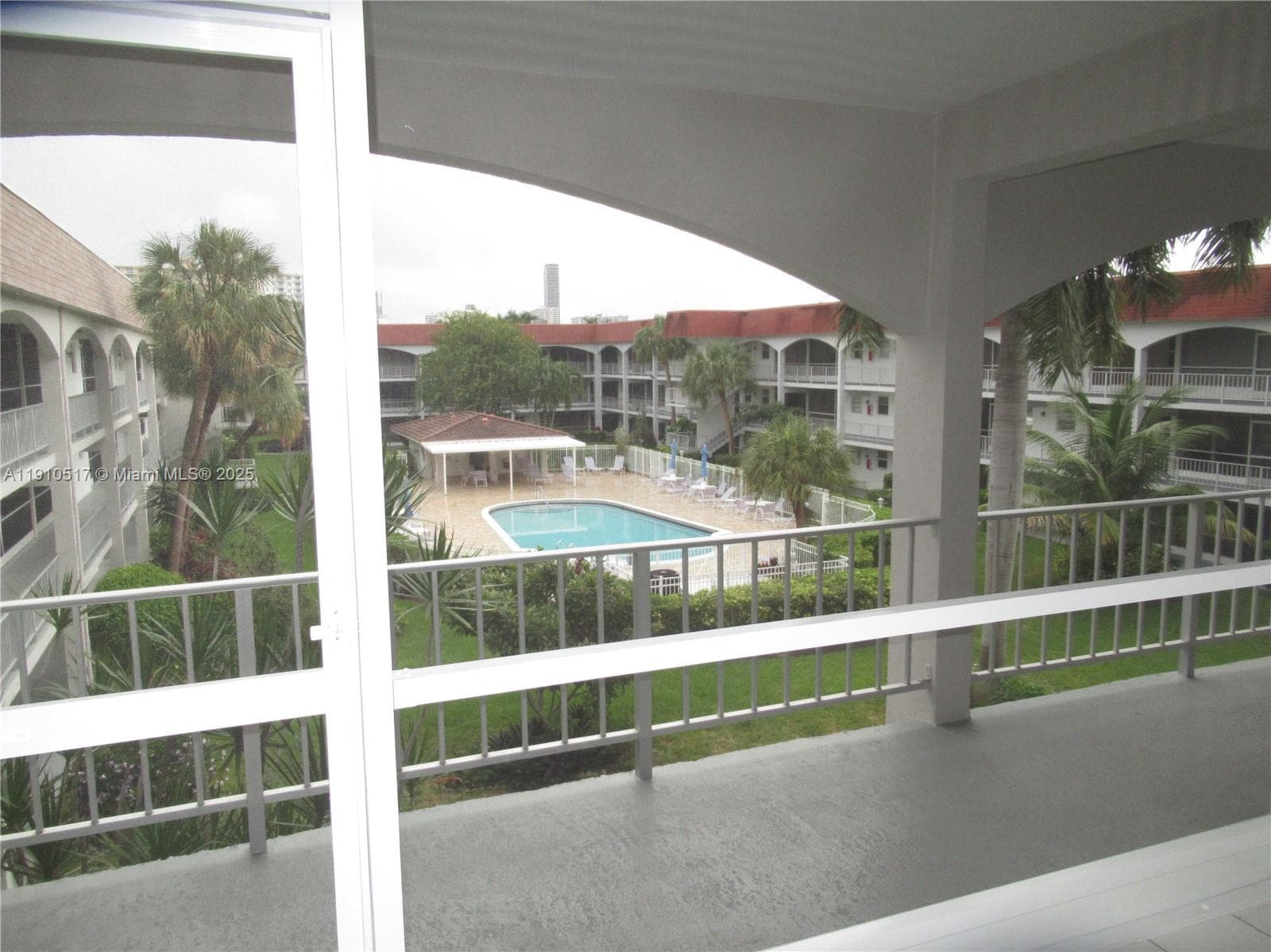 Newly screened porch overlooking the beautiful pool
