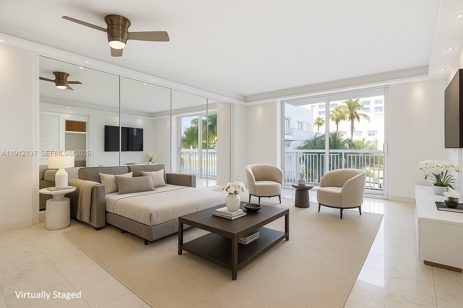 This bright and airy studio welcomes you with sleek floors, floor-to-ceiling mirrors, and expansive sliding glass doors that fill the space with natural light. The open layout feels incredibly spacious, while the private balcony showcases lush palm-tree views and a hint of the ocean beyond. Thoughtfully updated with modern recessed lighting, a contemporary ceiling fan, and clean, minimalist finishes, this residence offers the perfect blend of style and serenity. A rare South Beach oasis