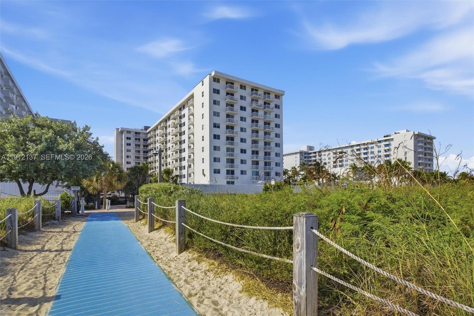 Step to the beach and feel the soft white sand beneath your feet as you walk toward the turquoise waters of the Atlantic. Lined with swaying sea grass and open to endless ocean views, this serene pathway invites you to experience the essence of Miami Beach living. Whether it’s a morning stroll at sunrise, a relaxing afternoon under an umbrella, or a sunset walk along the shoreline, this direct access offers the perfect gateway to your coastal escape.