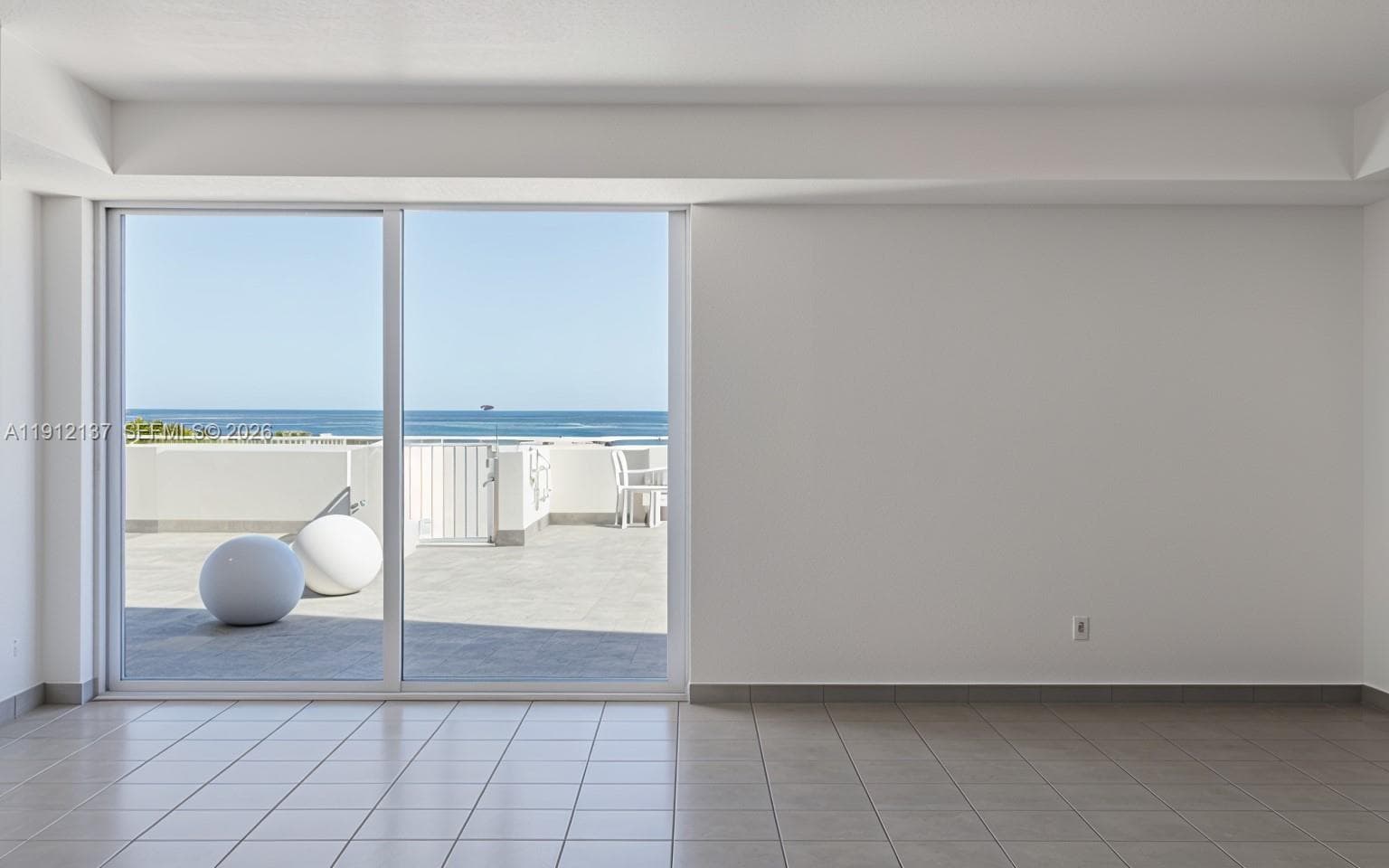 This bright and versatile recreation room offers the perfect space for gatherings, wellness activities, or social events — all set against a backdrop of stunning ocean views. The large sliding glass doors fill the room with natural light and open directly to the pool deck, creating a seamless indoor-outdoor flow. Whether used for private celebrations, meetings, or quiet relaxation, this inviting amenity enhances the building’s resort-style atmosphere and embodies the best of Miami Beach coastal living.