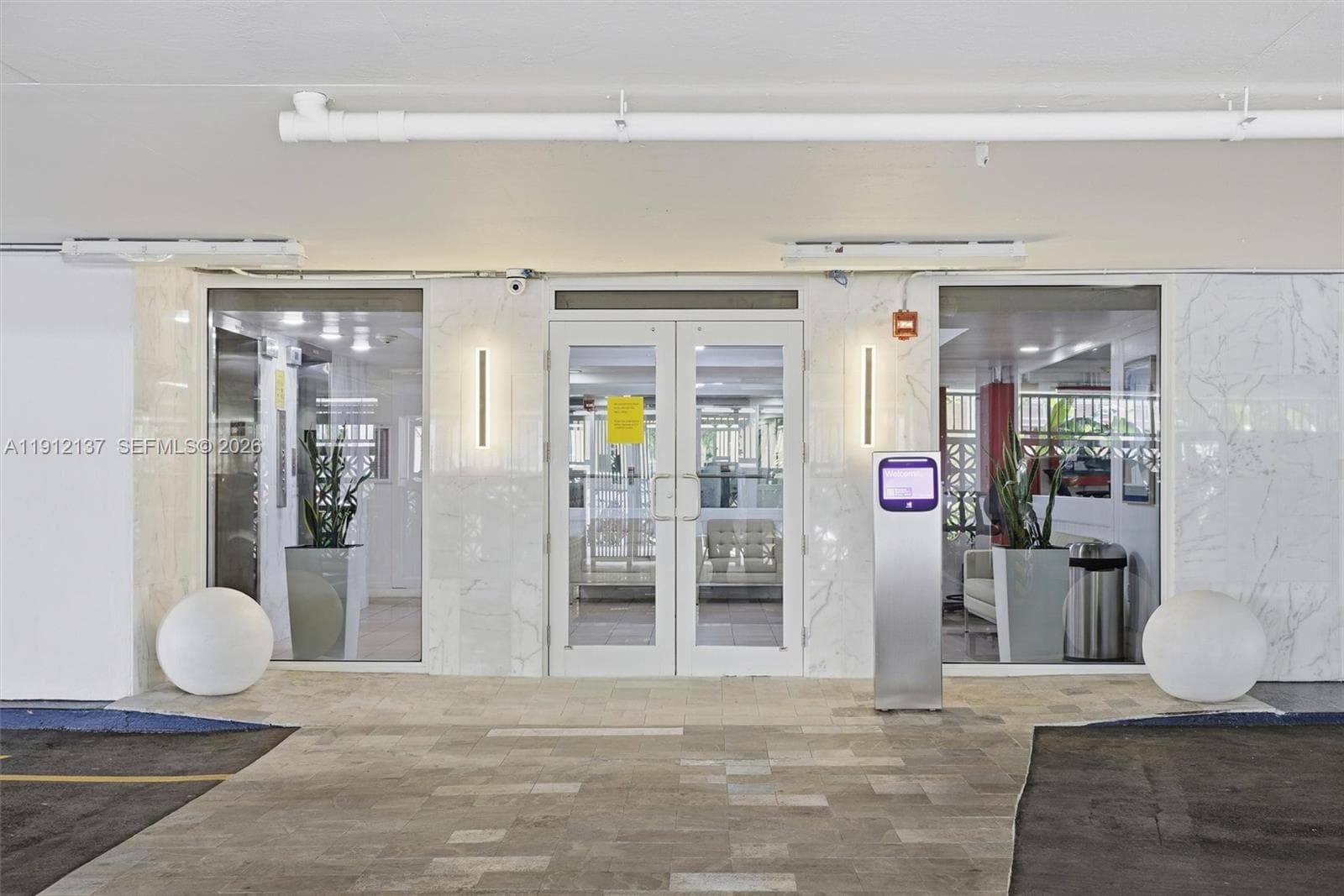 Welcome to the building’s elegant main lobby, designed to provide both style and security. The entrance features sleek glass doors, polished marble finishes, and contemporary lighting that creates a refined first impression. A second secured access point ensures privacy and peace of mind for residents and guests alike. With its modern design, controlled entry system, and inviting ambiance, this lobby sets the tone for the sophisticated South Beach lifestyle that awaits inside