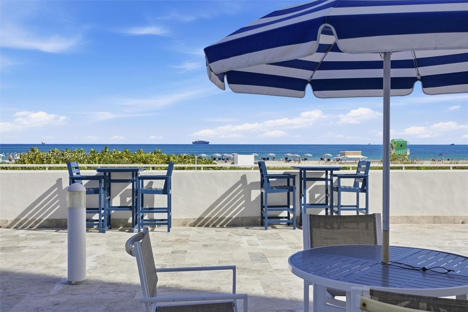 Relax and unwind on this elegant oceanfront pool deck, where endless blue skies meet the sparkling Atlantic. Stylish lounge areas and shaded café tables create the perfect setting to enjoy morning coffee or sunset cocktails with panoramic beach views. The elevated terrace overlooks the shoreline, offering a front-row seat to Miami Beach’s vibrant coastal scenery. Whether basking in the sun, dining al fresco, or simply taking in the ocean breeze, this pool deck delivers the ultimate South Beach lifestyle